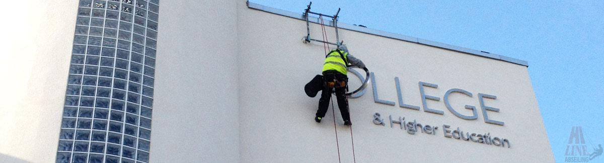 Sign Fixing with Abseilers